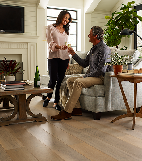 Couple sharing drinks from Migliore’s Flooring & Rugs in Cookeville